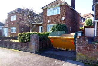 Large skip in narrow driveway